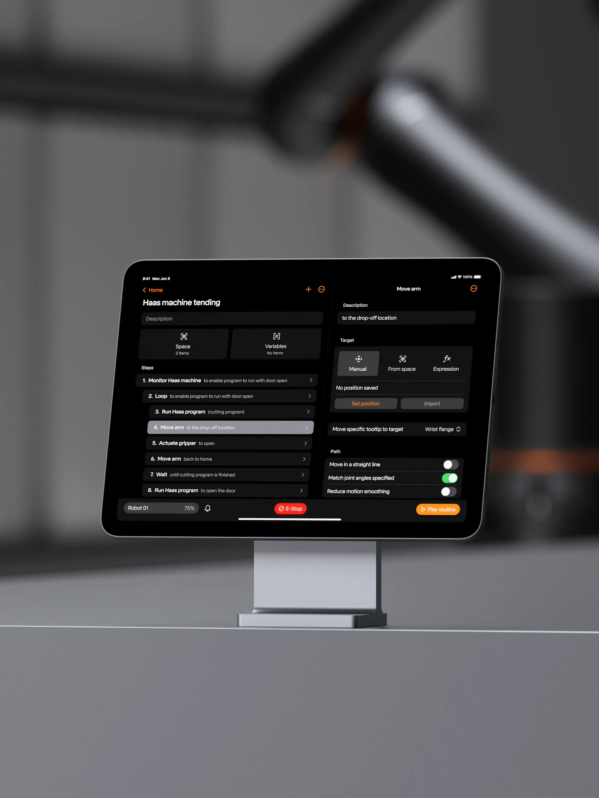 An iPad on a workshop stand showing a machine-tending routine