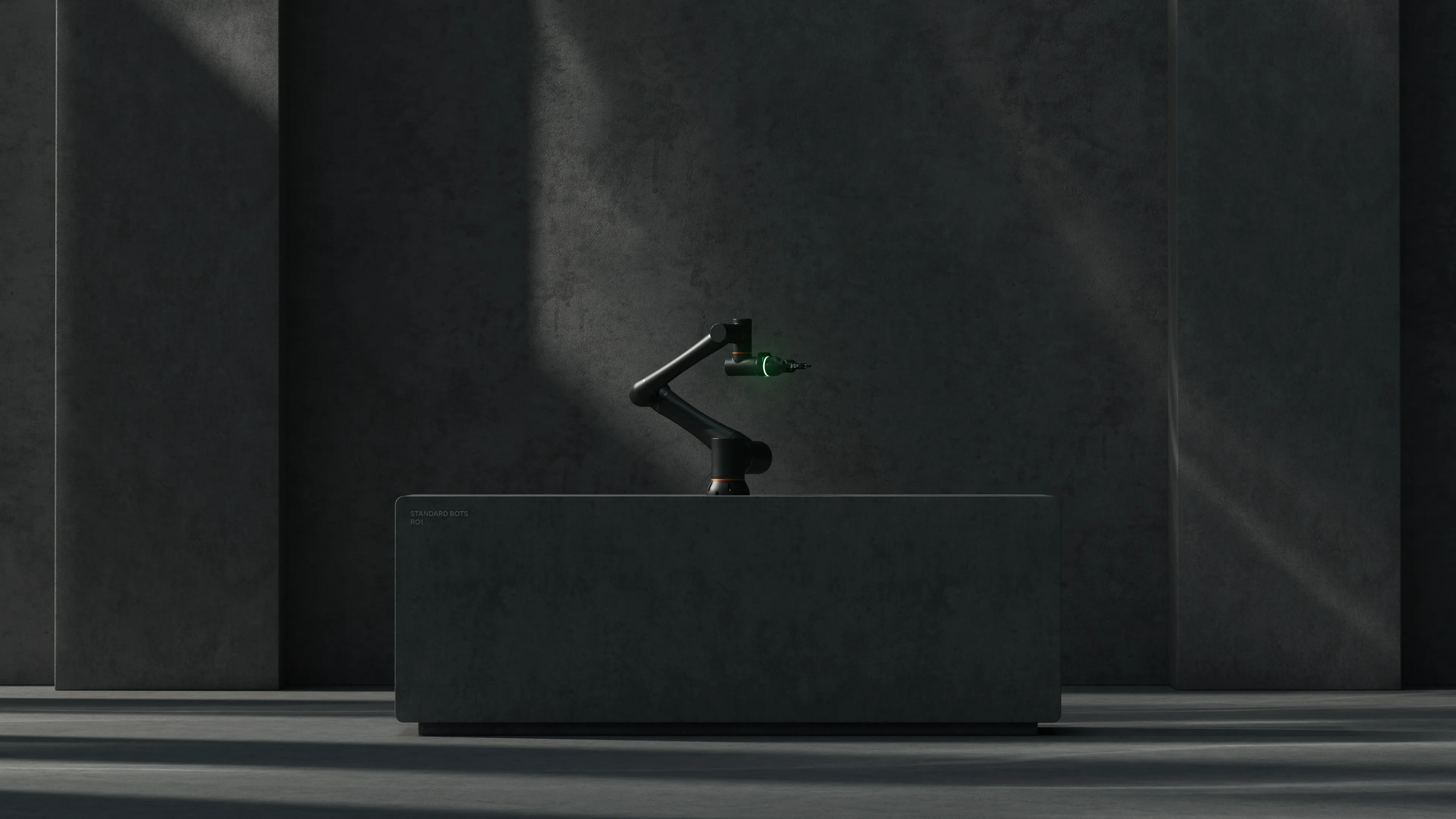The Standard Bots RO1 arm on a dark plinth