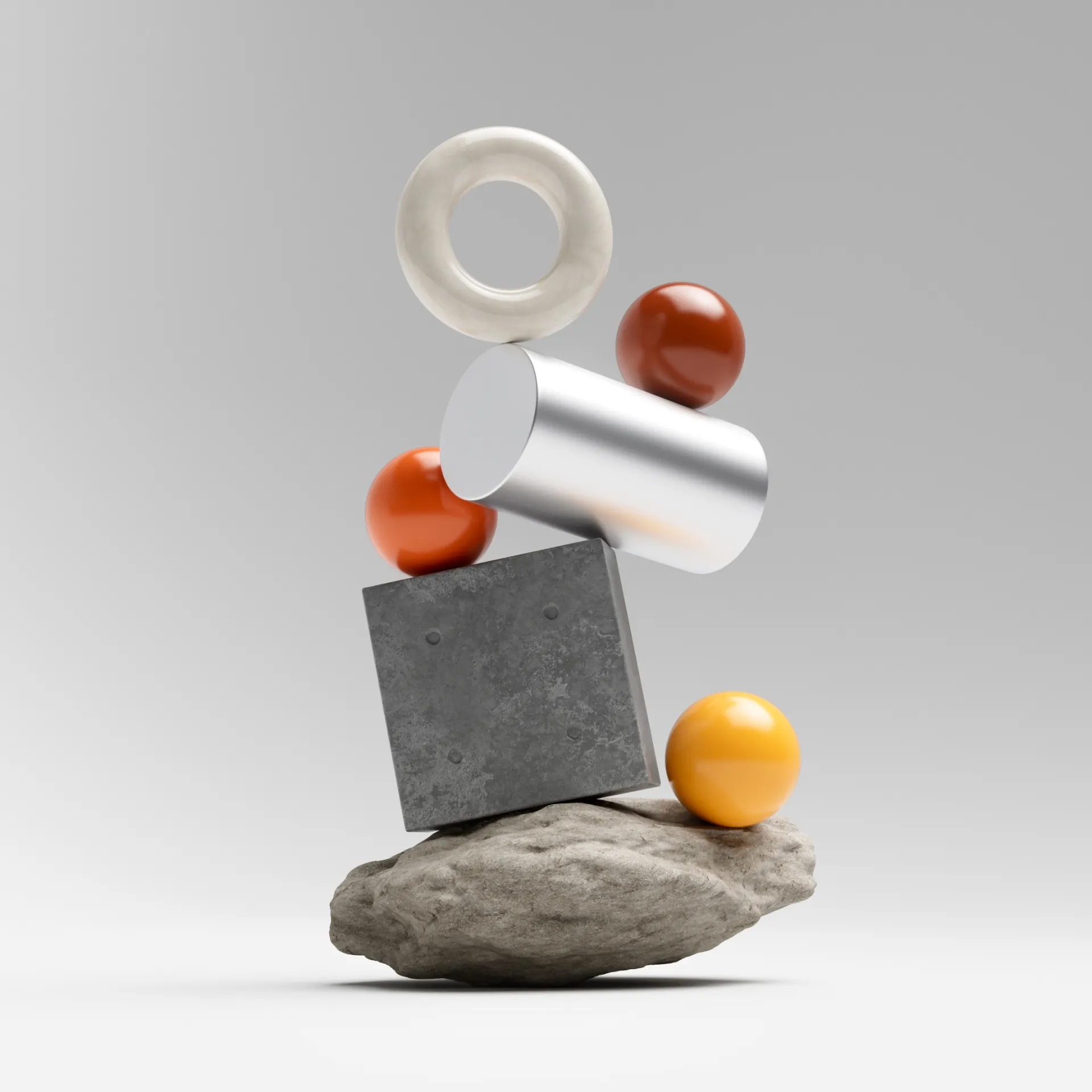 A brand still life — a ring, cylinder, concrete cube, and spheres balanced on a rock