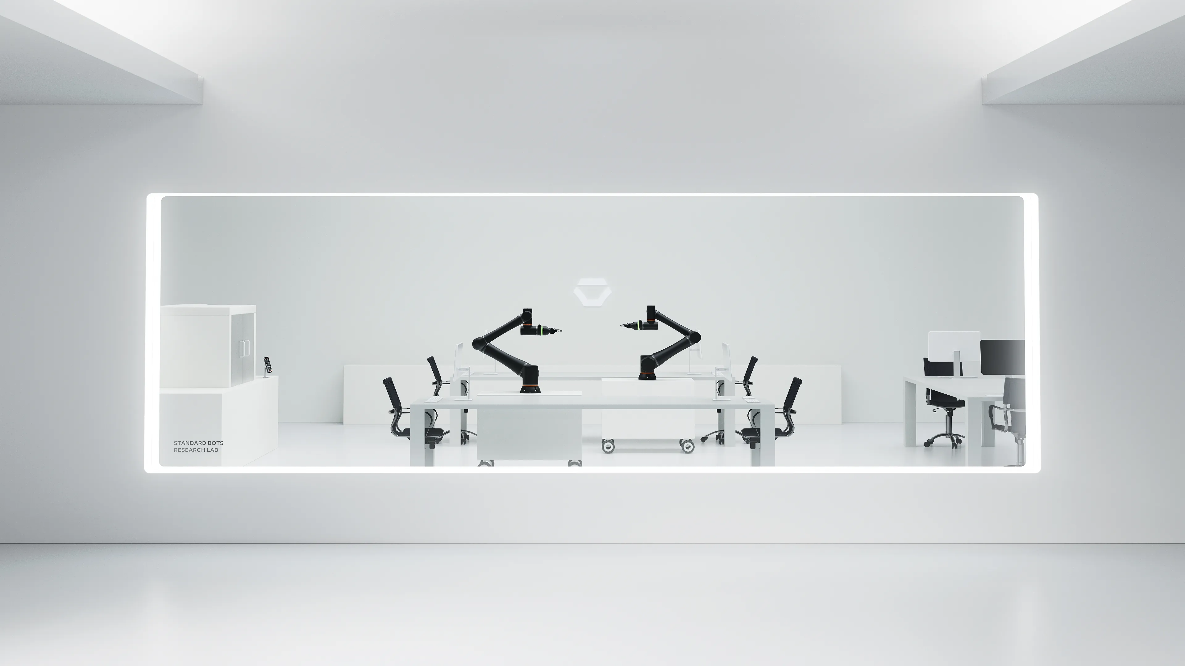 A Standard Bots research lab with two arms working at a lit bench